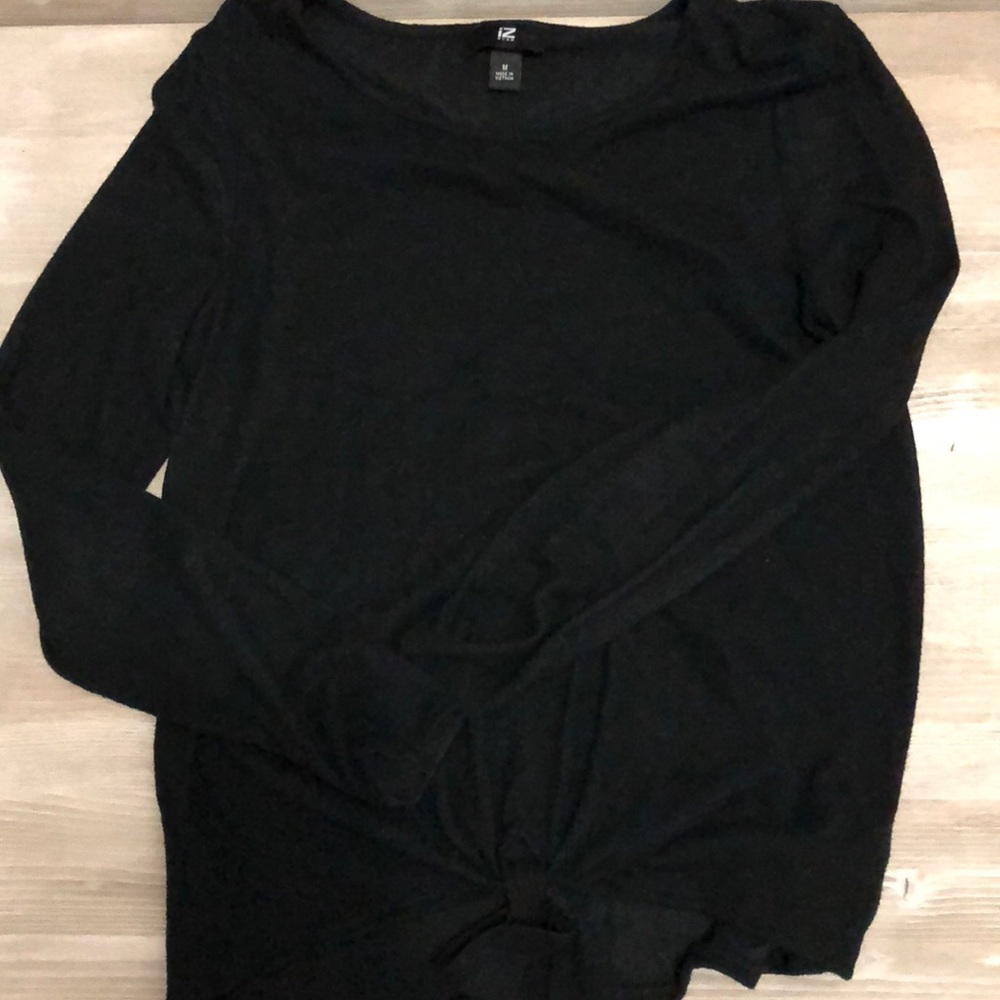 Black sweater with tie at bottom